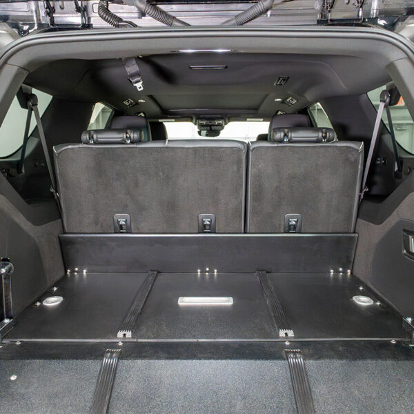 The 3rd row of seats in a Cadillac Escalade upright with the SR75 mini deck installed.