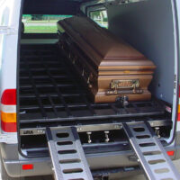 DD4000 with one casket secured on tilted down upper deck