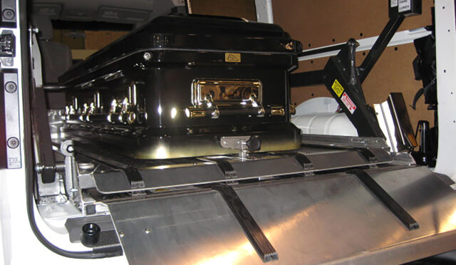 DD2000-XLC top deck lowered with casket loaded