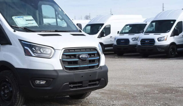 Several Ford e-Transits lined up